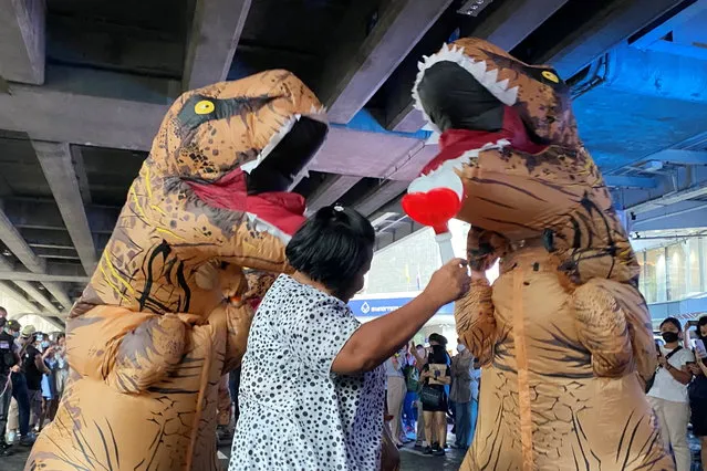 Dinosaur costumed actors representing Thailand's establishment at a high school student led protest in Bangkok, Thailand on November 21, 2020. (Photo by Matthew Tostevin/Reuters)