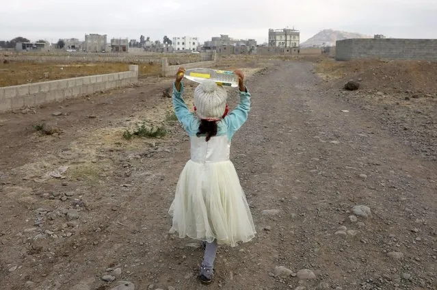 A Yemeni child carries a water bottle after filling it from a donated tank before going to school, on the outskirts of Sana'a, Yemen, 28 January 2023. Some 21.6 million Yemeni people require humanitarian and protection assistance in 2023, almost half of which are children, as they are suffering from food insecurity and lack of access to basic services due to eight years of the war in Yemen, Save the Children has reported. (Photo by Yahya Arhab/EPA/EFE)