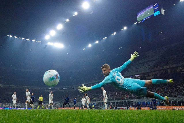 A ball flies past Lazio goalkeeper Ivan Provedel during a Serie A match in Milan, Italy, on Sunday, November 9, 2025. The goal was overturned by video review after it was determined there was a handball in the buildup. Inter Milan still won 2-0. (Photo by Alessandro Garofalo/Reuters)
