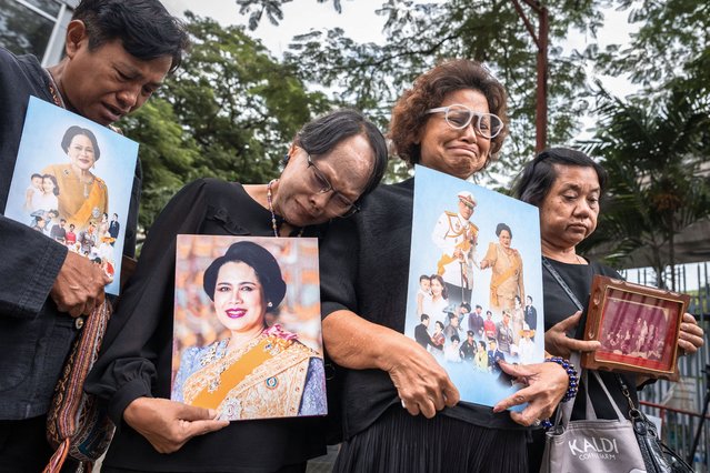 People hold portraits of Thailand's former Queen Sirikit as they gather in front of Chulalongkorn Hospital, where she passed away, in Bangkok on October 25, 2025. Thailand's former Queen Sirikit, the mother of the current King Vajiralongkorn and wife of the nation's longest-reigning monarch, died late on October 24 at the age of 93, the palace said. (Photo by Chanakarn Laosarakham/AFP Photo)