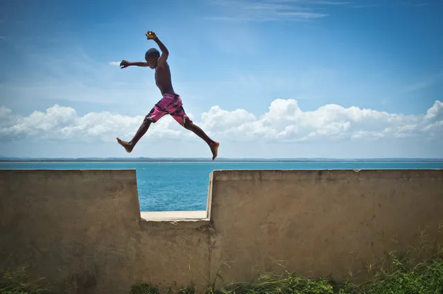 “Child Soul – Bahia Brazil”. This boy was playing jumping every gap of the 500 meters fortress wall. Every jump was unique and full of joy and lightness. Location: Morro de Sao Paulo, Bahia, Brazil. (Photo and caption by Mauricio Pisani/National Geographic Traveler Photo Contest)
