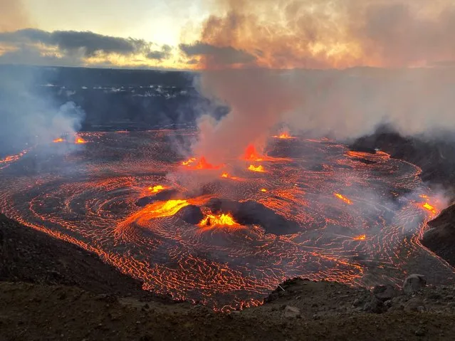 This handout image provided by US Geological Survey (USGS) on June 7, 2023, shows Kilauea erupting from the Halemaumau summit crater within a closed area of Hawai'i Volcanoes National Park in Hawaii. One of the world's most active volcanoes has erupted again, with lava spewing from Kilauea in Hawaii on Wednesday. Footage showed fissures have opened up at the base of a crater on the volcano, which regularly springs to life, with vulcanologists calling the eruption “dynamic”. (Photo by US Geological Survey/AFP Photo)