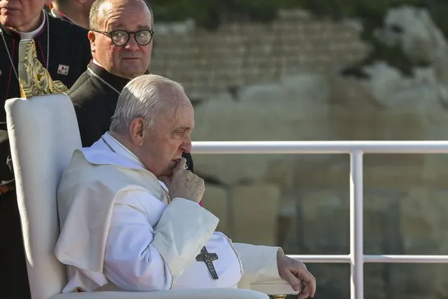 Pope Francis sits next to Malta's Archbishop Charles Jude Scicluna, left, aboard a catamaran leaving Valletta's harbor for Gozo in Malta Saturday, April 2, 2022. Pope Francis headed to the Mediterranean island nation of Malta on Saturday for a pandemic-delayed weekend visit, aiming to draw attention to Europe's migration challenge that has only become more stark with Russia's invasion of Ukraine. (Photo by Andreas Solaro/Pool via AP Photo)
