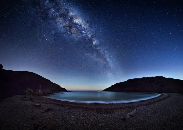 Milky Way stretches across the night sky reflecting on the Cable Bay near Nelson, New Zealand. (Photo by Mark Gee/Astronomy Photographer of the Year 2018)