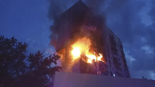 In this photo provided by the Ukrainian Emergency Service, a fire is seen following an explosion caused by a gas leak in a 16-story residential building in Kyiv, Ukraine, Thursday, June 22, 2023. (Photo by Ukrainian Emergency Service via AP Photo)