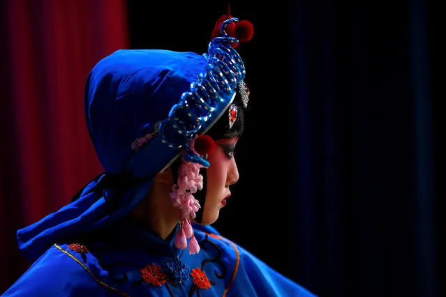 A participant waits backstage during a traditional Chinese opera competition at the National Academy of Chinese Theatre Arts in Beijing, China, November 26, 2016. (Photo by Thomas Peter/Reuters)