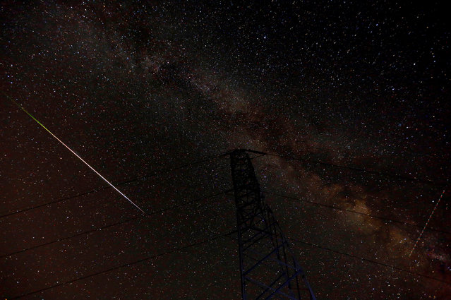 A meteor streaks over the skies over the milky way during the peak of Perseid meteor shower in Kozjak, Macedonia on August 13, 2018. (Photo by Ognen Teofilovski/Reuters)