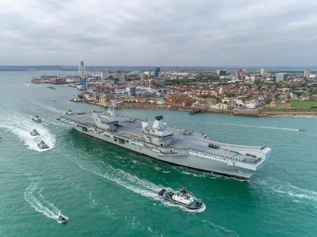 HMS Queen Elizabeth leaves Portsmouth Harbour in Hampshire, United Kingdom on August 18, 2018 for the US to undergo flight trials with the F35B for the first time. (Photo by SWNS: South West News Service)