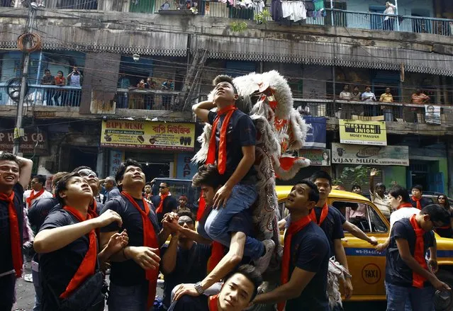 Members of a lion dance troupe take part in the celebrations to mark the Chinese Lunar New Year in Kolkata February 19, 2015. (Photo by Rupak De Chowdhuri/Reuters)