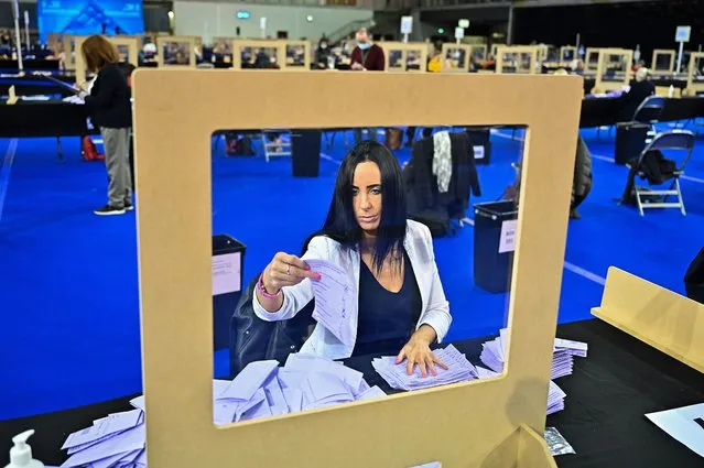 Staff members count ballots at the main Glasgow counting centre in the Emirates Arena on May 06, 2021 in Glasgow, Scotland. All 129 Members of the Scottish Parliament (MSPs) will be elected. 73 MSPs will be chosen to represent constituencies across Scotland and 56 will be elected from eight member regions selecting seven MSPs each. (Photo by Jeff J. Mitchell/Getty Images)