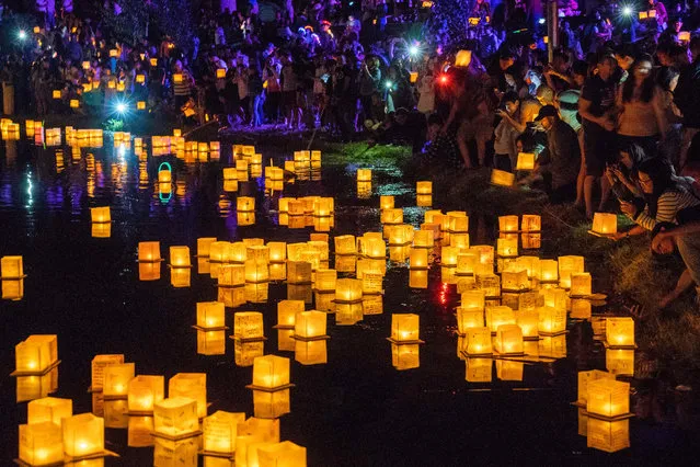 People attend Water Lantern Festival in Los Angeles, the United States, September 15, 2018. (Photo by Qian Weizhong/Xinhua News Agency/Barcroft Images)
