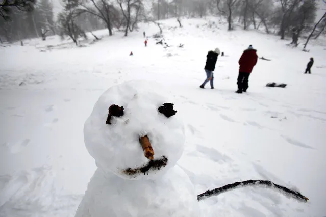 The fourth front in as many days in San Diego County produced snow on Mount Laguna, Calif., and the area around it, making for a winter wonderland for children and adults alike.|Snowmen were abundant at the recreation area off Sunrise Highway near Mt. Laguna, Calif., Thursday, January 7, 2016. (Photo by John Gastaldo/The San Diego Union-Tribune via AP Photo)