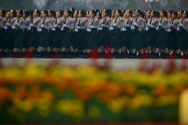 Female soldiers parade to mark the 70th anniversary of Armed Forces Day in Myanmar's capital Naypyitaw, March 27, 2015. The parade commemorates the day when independence hero General Aung San gave the command to the units of the independence army to launch nation-wide resistance against Japanese occupation. (Photo by Soe Zeya Tun/Reuters)