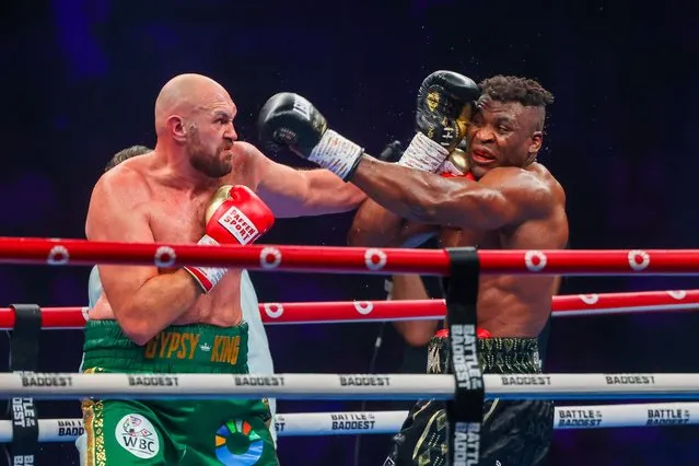 Britain's Tyson Fury (L) fights against Cameroonian-French Francis Ngannou during their heavyweight boxing match in Riyadh early on October 29, 2023. (Photo by Fayez Nureldine/AFP Photo)