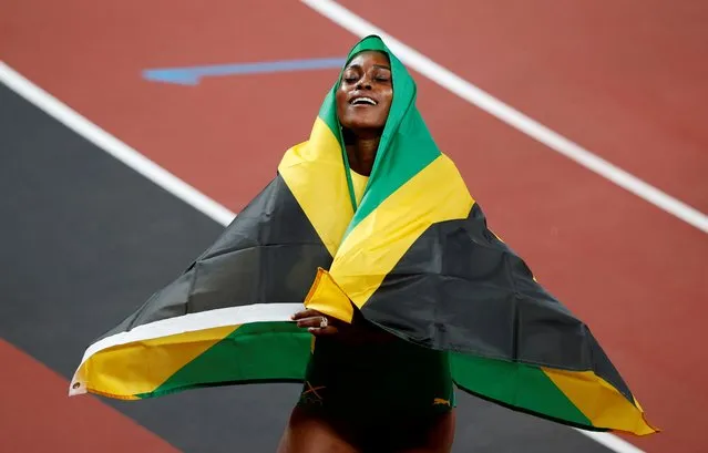 Elaine Thompson-Herah of Jamaica celebrates victory in the Women's 100m final on day eight of the Tokyo 2020 Olympic Games at Olympic Stadium on July 31, 2021 in Tokyo, Japan. (Photo by Phil Noble/Reuters)