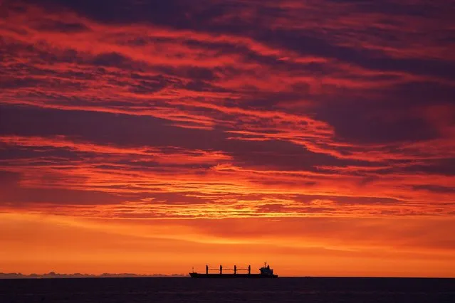 A ship on the North Sea off the coast of Tynemouth, UK during sunrise on Friday, September 1, 2023. (Photo by Owen Humphreys/PA Images via Getty Images)