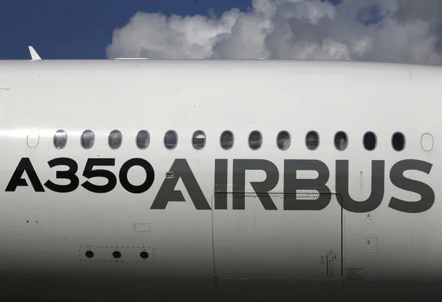 An Airbus A350 XWB aircraft is displayed during the opening day of the Singapore Airshow at Changi Exhibition Center February 16, 2016. (Photo by Edgar Su/Reuters)