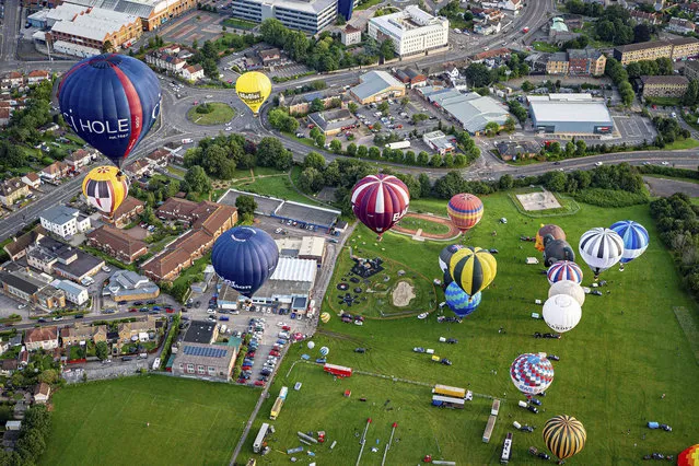 Balloons take off during the first mass ascent of the “Fiesta Fortnight” in Filton, England, Wednesday August 4, 2021. (Photo by Ben Birchall/PA Wire via AP Photo)
