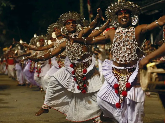 Sri Lankan traditional dancers perform during the annual Nawam Perahera street parade in Colombo February 22, 2016. (Photo by Dinuka Liyanawatte/Reuters)