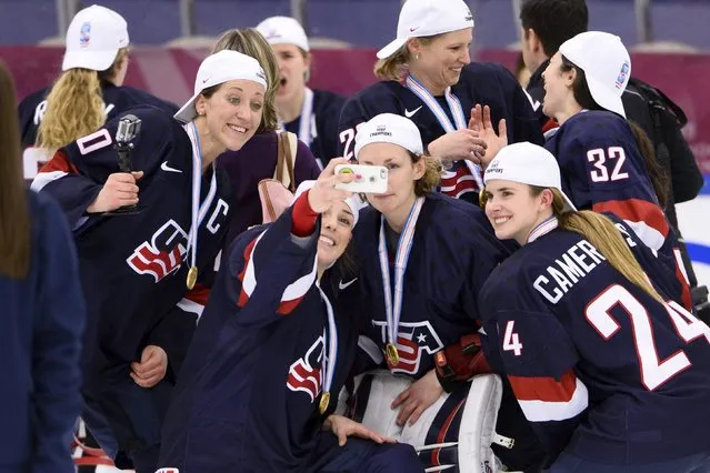 Team USA players pose for a selfie after winning the 2015 IIHF Ice Hockey Women's World Championship gold medal match between USA and Canada at Malmo Isstadion in Malmo, southern Sweden, April 4, 2015. USA won the match by 7-5. (Photo by Claudio Bresciani/Reuters/TT)