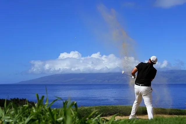 Byeong Hun An hits from the bunker along the 12th fairway during the final round of The Sentry golf event, Sunday, January 7, 2024, at Kapalua Plantation Course in Kapalua, Hawaii. (Photo by Matt York/AP Photo)