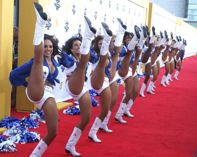 The Dallas Cowboy cheerleaders perform on the red carpet at the 50th annual Academy of Country Music Awards at AT&T Stadium on Sunday, April 19, 2015, in Arlington, Texas. (Photo by Jack Plunkett/Invision/AP Photo)