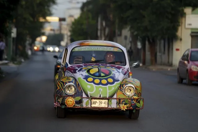 Rene Penia drives his VW Beetle 1995, locally called “Vocho”, through the streets of Monterrey April 22, 2015. (Photo by Daniel Becerril/Reuters)