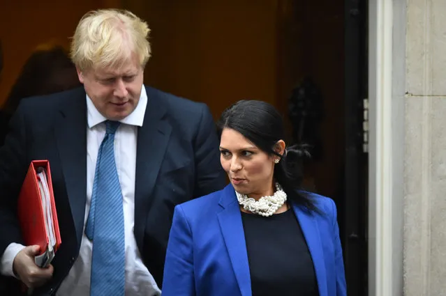 British foreign minister Boris Johnson and Britain' s International Development Secretary Priti Patel leave the weekly meeting of the cabinet at 10 Downing Street in central London on January 31, 2017. (Photo by Glyn Kirk/AFP Photo)