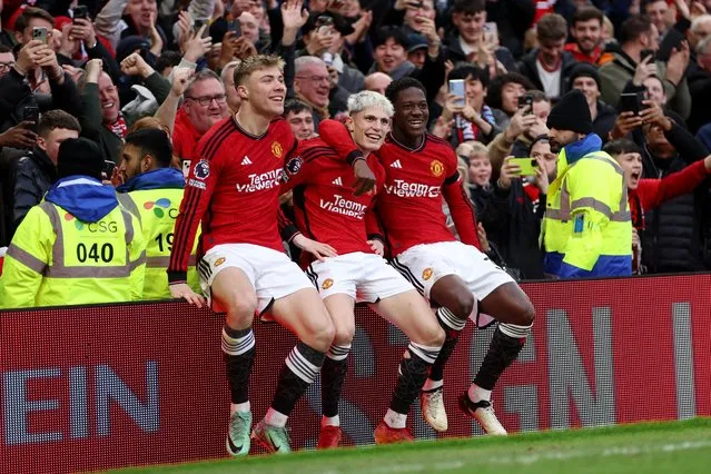 Alejandro Garnacho of Manchester United celebrates with Rasmus Hojlund and Kobbie Mainoo of Manchester United after scoring his team's second goal during the Premier League match between Manchester United and West Ham United at Old Trafford on February 04, 2024 in Manchester, England. (Photo by Clive Brunskill/Getty Images)