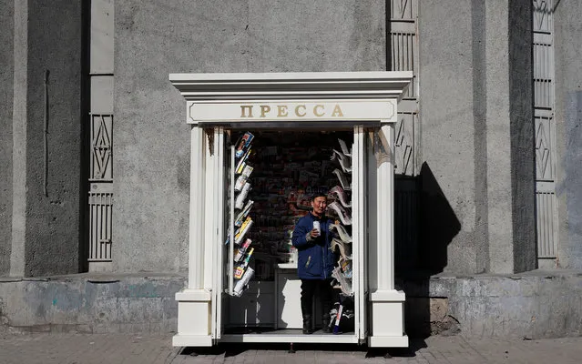 A newspaper vendor looks on in Moscow, Russia on April 2, 2019. (Photo by Maxim Shemetov/Reuters)