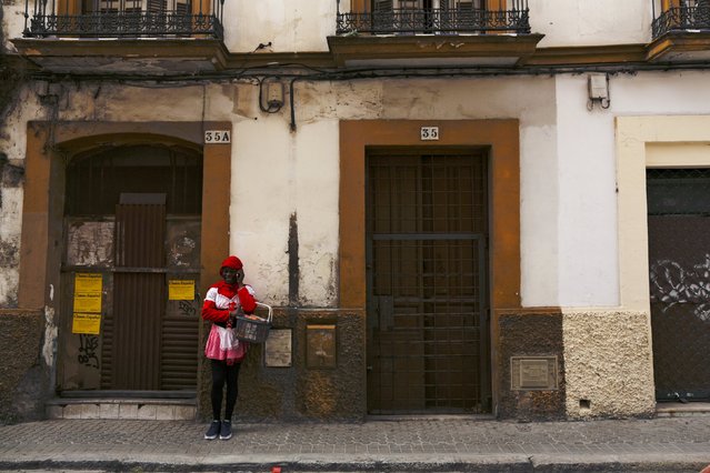 Howard Jackson, a Liberian migrant, talks on a mobile phone in the Andalusian capital of Seville, southern Spain February 24, 2016. (Photo by Marcelo del Pozo/Reuters)