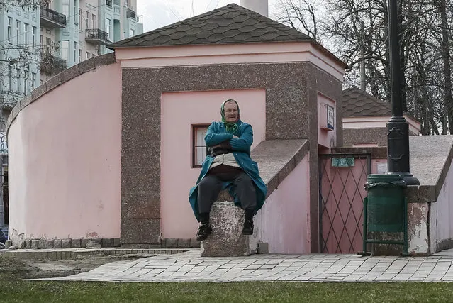 A cashier awaits clients as she sells tickets to a public toilet in a park in central Kiev, Ukraine, March 30, 2016. (Photo by Gleb Garanich/Reuters)