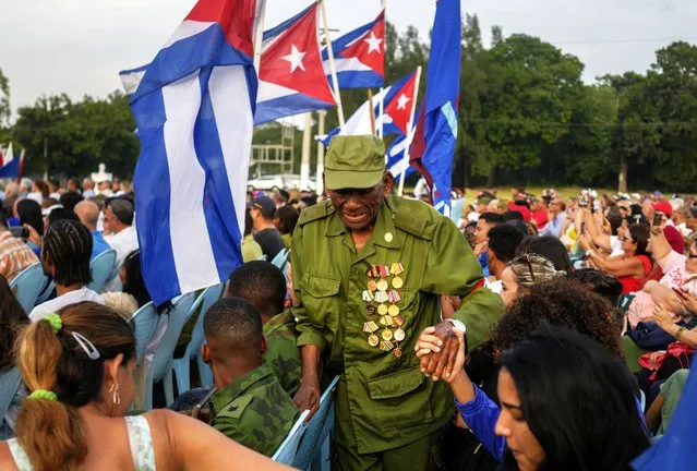 A veteran of the 1959 Cuban Revolution attends a ceremony marking the 65th anniversary of the arrival of Fidel Castro to the capital as head of the rebel army, in Havana, Cuba, Monday, January 8, 2024. Castro and his rebels arrived in Havana via caravan on Jan. 8, 1959, after toppling dictator Fulgencio Batista. (Photo by Ramon Espinosa/AP Photo)