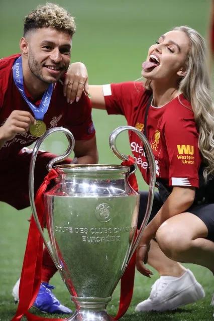 Alex Oxlade-Chamberlain of Liverpool celebrates with Girlfriend Perrie Edwards of Girl group Little Mix after his side won during the UEFA Champions League Final between Tottenham Hotspur and Liverpool at Estadio Wanda Metropolitano on June 01, 2019 in Madrid, Spain. (Photo by Carl Recine/Reuters)