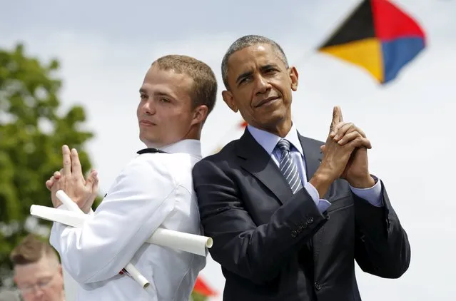 Graduate Robert McConnel asks U.S. President Barack Obama to strike a “James Bond” pose during the 134th Commencement Exercises of the United States Coast Guard Academy in New London, Connecticut May 20, 2015. (Photo by Kevin Lamarque/Reuters)