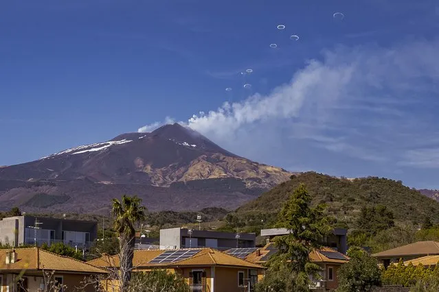 Volcanic vortex rings emerge from a new pit crater on the north side of the southeast crater of the Etna Volcano in Sicily, Italy, Friday, April 5, 2024. While the physical conditions under which volcanic vortex rings form are still not entirely known, scientists believe they are the result of a combination of fast gas release at the top of the magma conduit and regularity in the shape of the emitting vent. (Photo by Giuseppe Di Stefano/AP Photo)