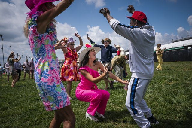 Spectators dance in the infield before the 150th running of the Kentucky Derby at Churchill Downs in Louisville, KY on Saturday, May 04, 2024. (Photo by Jabin Botsford/The Washington Post)