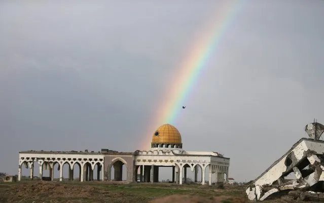 A rainbow is seen over the former Gaza International airport that was destroyed by Israeli air strikes, during a rainy day in Gaza January 2, 2016. (Photo by Ibraheem Abu Mustafa/Reuters)