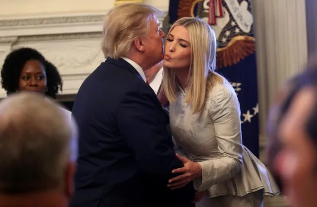 U.S. President Donald Trump says goodbye to his daughter, White House senior advisor Ivanka Trump, after participating in the “Pledge to America's Workers – One year Celebration” event in the State Dining Room of the White House in Washington, U.S., July 25, 2019. (Photo by Leah Millis/Reuters)