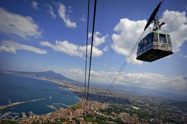 A cable car operates on its lines during the reopening, after years of renovation, of the cableway between Castellammare di Stabia railway station, near Naples, and Faito Mountain, overlooking Naples Gulf, in Naples, Italy, 04 May 2016. (Photo by Ciro Fusco/EPA)