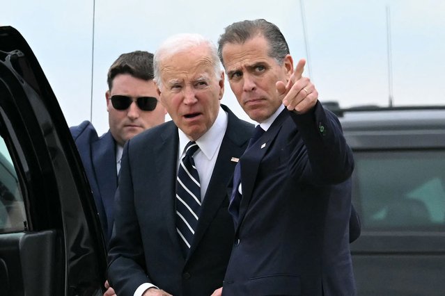 US President Joe Biden talks with his son Hunter Biden upon arrival at Delaware Air National Guard Base in New Castle, Delaware, on June 11, 2024, as he travels to Wilmington, Delaware. A jury found Hunter Biden guilty on June 11 on federal gun charges in a historic first criminal prosecution of the child of a sitting US president. The 54-year-old son of President Joe Biden was convicted on all three of the federal charges facing him, CNN and other US media reported. (Photo by Andrew Caballero-Reynolds/AFP Phoot)