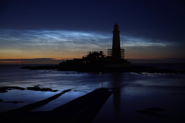 Noctilucent clouds or night clouds over St Mary's Lighthouse in Whitley Bay, North Tyneside, UK taken at 01.45 am. on Friday, July 5, 2024. (Photo by Owen Humphreys/PA Images via Getty Images)