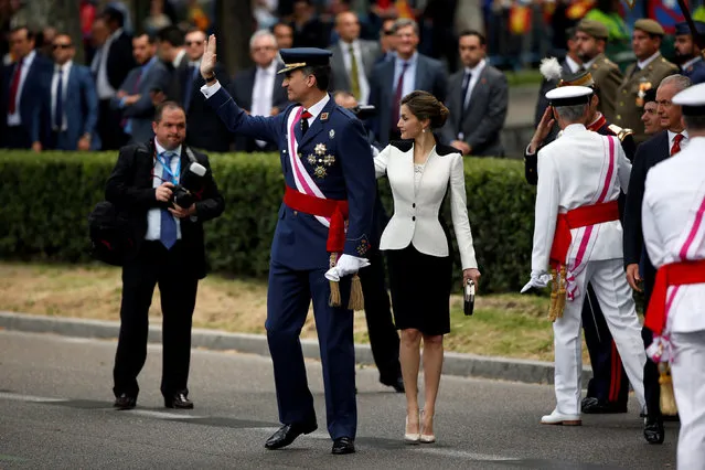 Spain's King Felipe and Queen Letizia wave as they leave after attending a ceremony marking Spain's Armed Forces Day in Madrid, Spain, May 28, 2016. (Photo by Susana Vera/Reuters)