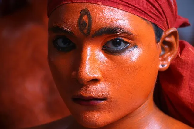 A young Hindu devotee with his body painted red takes part during a procession in the annual Lal Kach (Red Glass) festival in Munshiganj, Bangladesh.As the month of Chaitra, the last in the Bangla year, draws to an end, the Hindu community comes together in a festival dedicated to the worship of Lord Shiva and Parvati. On April 14, 2022 in Munshiganj, Bangladesh. (Photo by Joy Saha/Eyepix Group/Future Publishing via Getty Images)