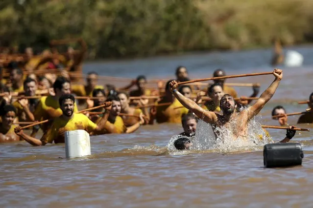 Competitors try to clear an obstacle during the Bravus Race in Brasilia, August 2, 2015. Bravus Race challenges competitors to overcome several obstacles over a course of up to 15 km (9.32 miles). (Photo by Ueslei Marcelino/Reuters)