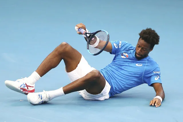 Gael Monfils of France falls to the ground after playing a shot during his match against Cristian Garin of Chile at the ATP Cup tennis tournament in Brisbane, Australia, Saturday, January 4, 2020. (Photo by Tertius Pickard/AP Photo)
