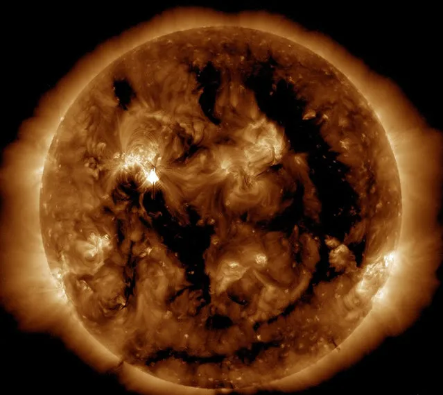 This May 9, 2012 image of the Sun provided by the Solar Dynamic Observatory’s Atomospheric Imaging Assembly (SDO/AIA)shows activity at the huge sunspot complex, known as AR 1476(Upper-L), that rotated into Earth’s view over the weekend
