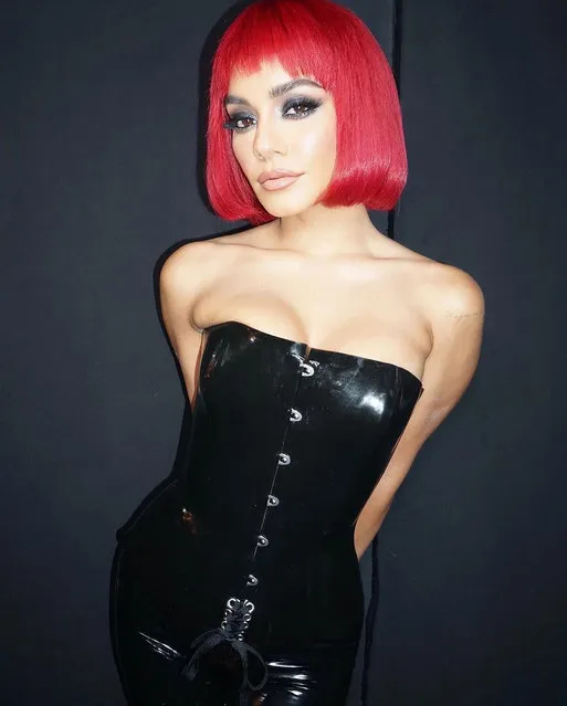American actress Vanessa Hudgens teases fans in a corset and red wig at the 2022 MTV Movie & TV Awards at Barker Hangar on June 05, 2022 in Santa Monica, California. (Photo by vanessahudgens/Instagram)