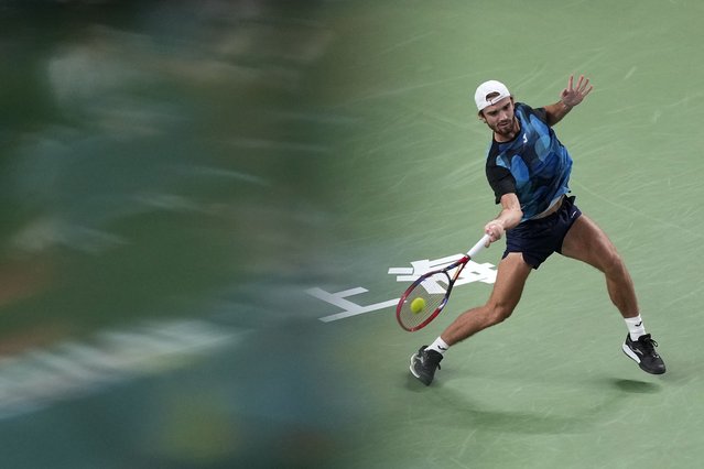 Tomas Machac of the Czech Republic plays a forehand return against Carlos Alcaraz of Spain during the men's singles quarterfinals match in the Shanghai Masters tennis tournament at Qizhong Forest Sports City Tennis Center in Shanghai, China, Thursday, October 10, 2024. (Photo by Andy Wong/AP Photo)