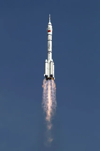 Shenzhou 9 spacecraft rocket launches from the Jiuquan Satellite Launch Center in Jiuquan, China, Saturday, June 16, 2012